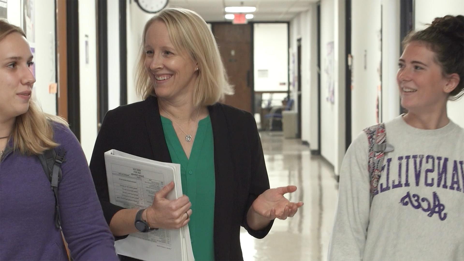 Alison Jones walking with students